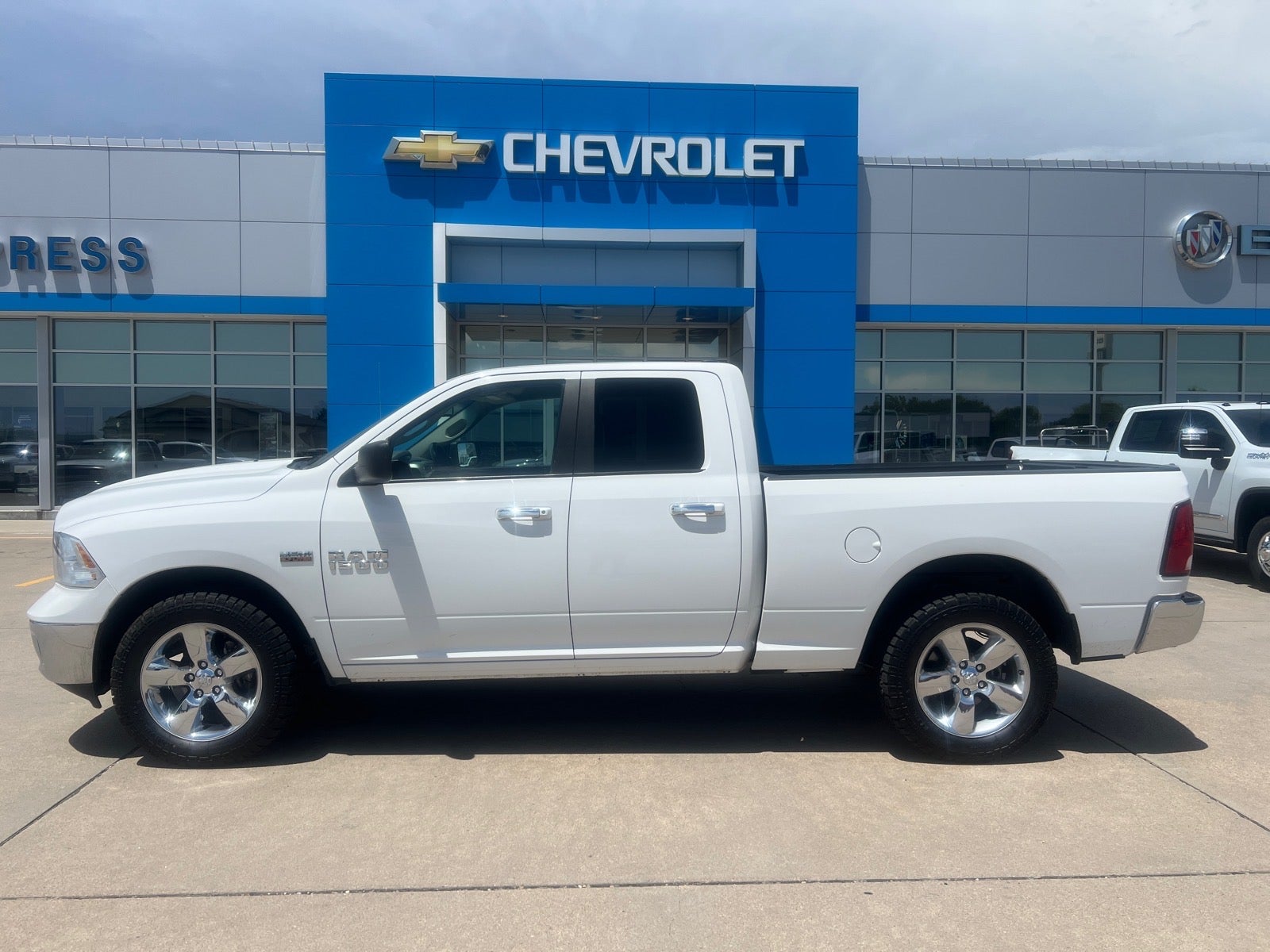 2016 RAM 1500 Big Horn in White — front three-quarter view