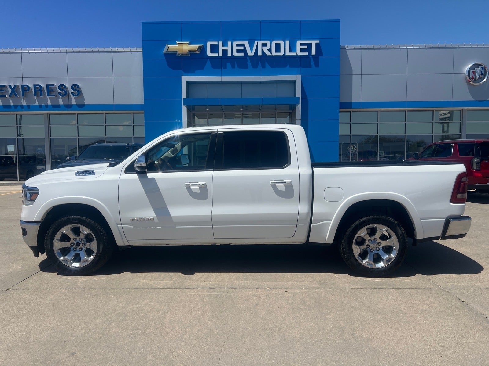2022 RAM 1500 Laramie in White — front three-quarter view