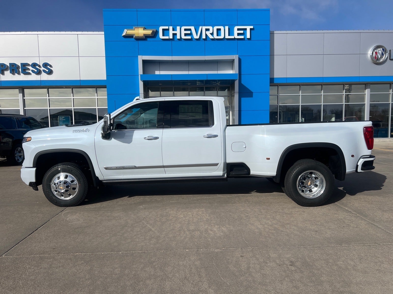 2026 Chevrolet Silverado 3500 HD High Country DRW in Polar White Tricoat — front three-quarter view