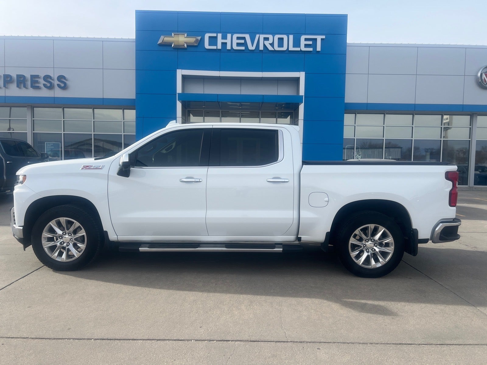 2021 Chevrolet Silverado 1500 LTZ in Summit White — front three-quarter view