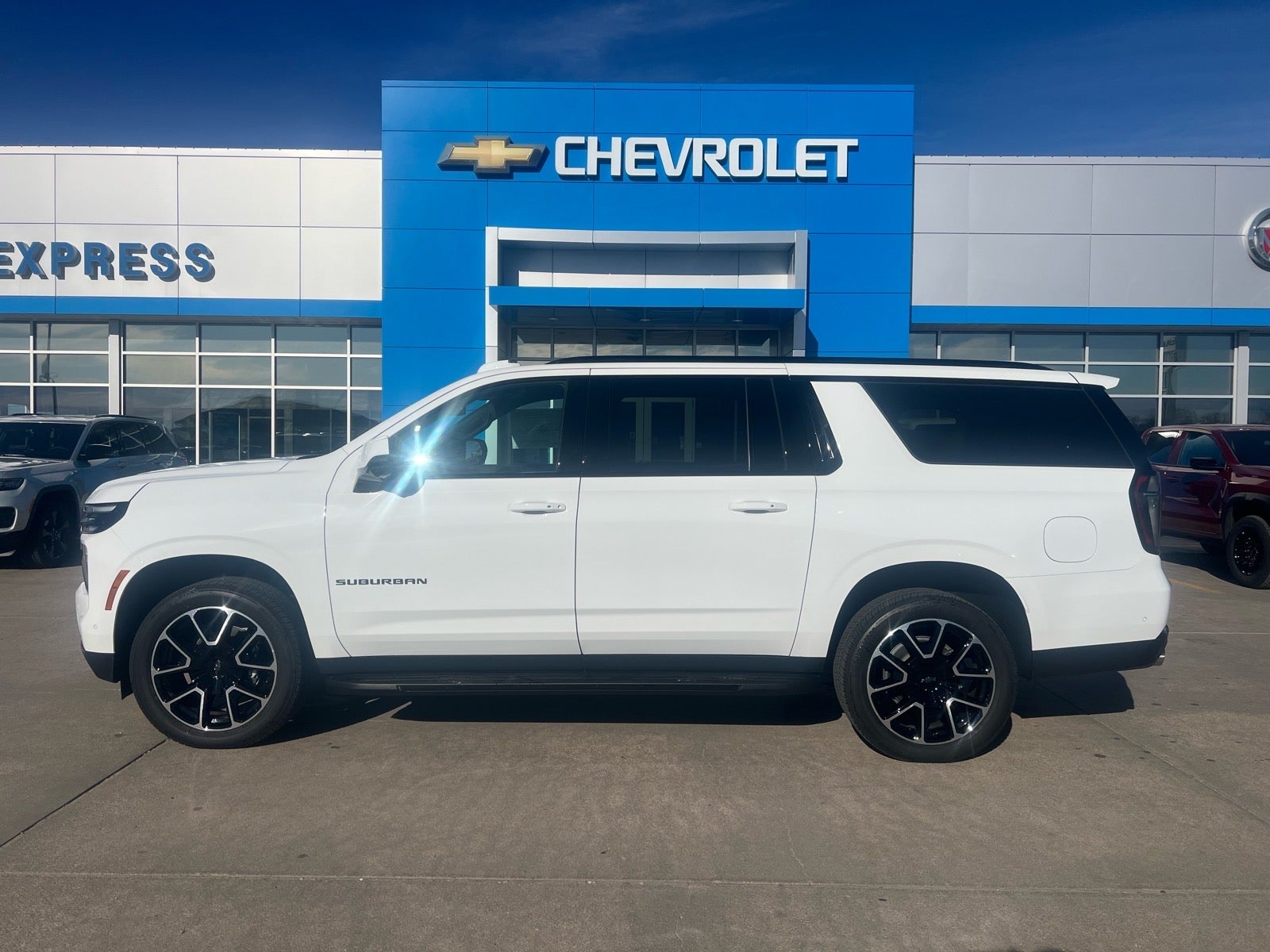2026 Chevrolet Suburban RST in Summit White — front three-quarter view