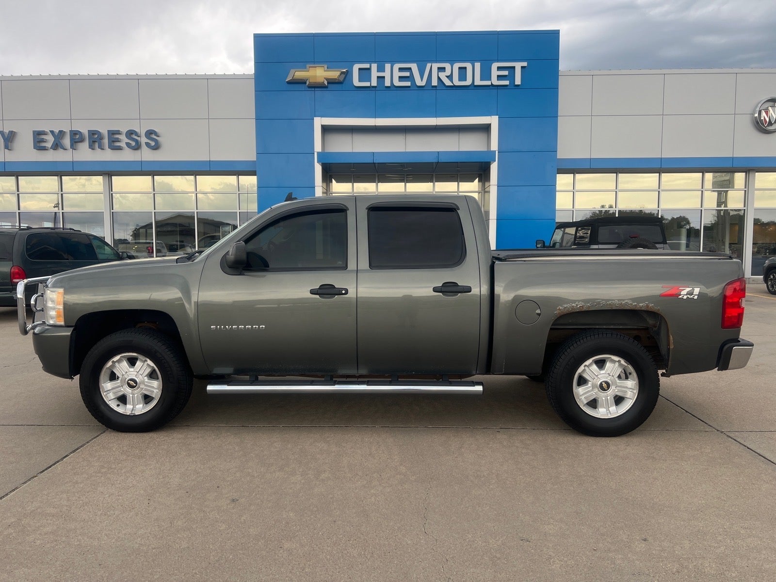 2011 Chevrolet Silverado 1500 LT in Steel Green Metallic — front three-quarter view