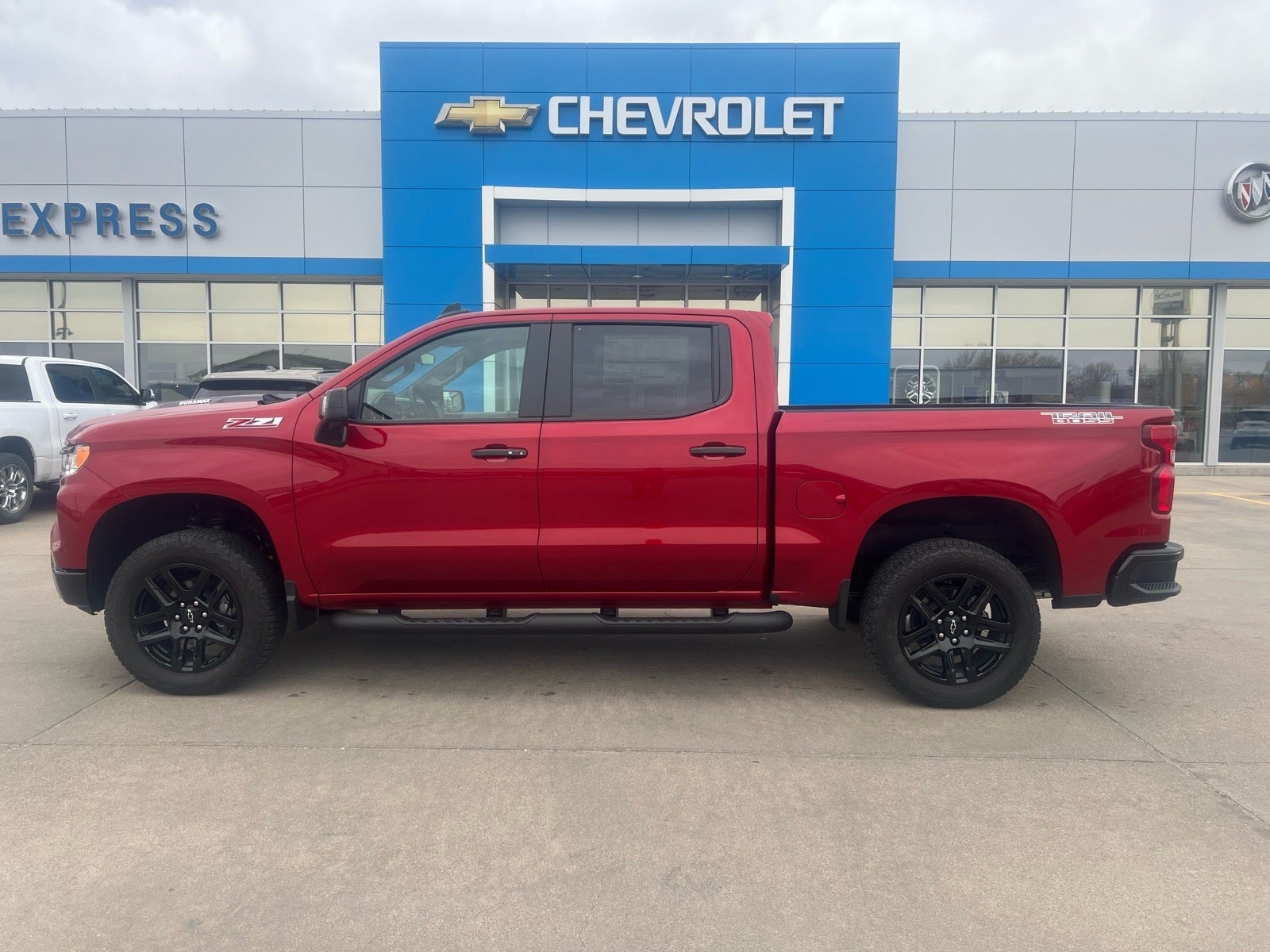 2026 Chevrolet Silverado 1500 LT Trail Boss in Radiant Red Tintcoat — front three-quarter view