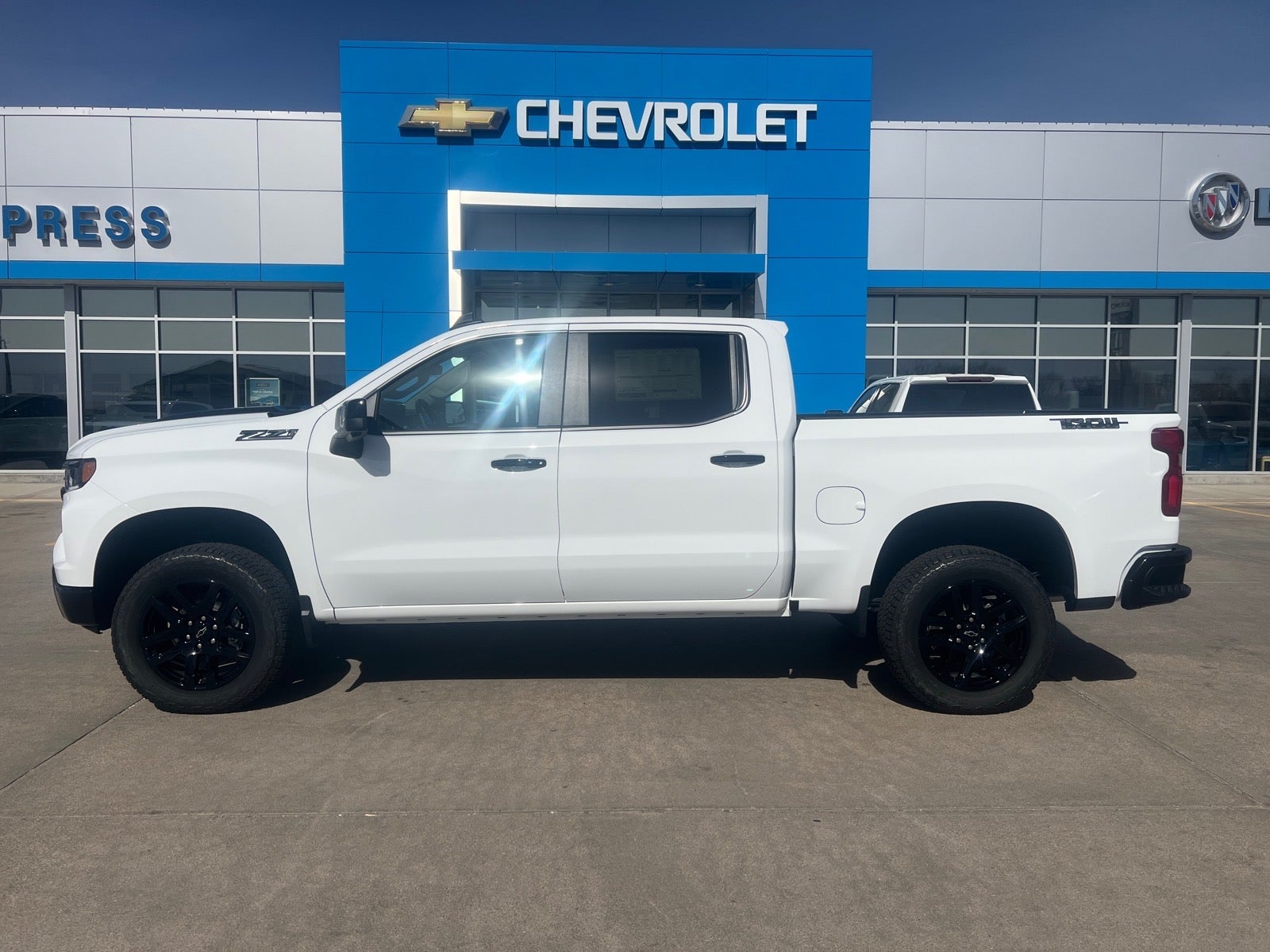 2026 Chevrolet Silverado 1500 LT Trail Boss in Summit White — front three-quarter view