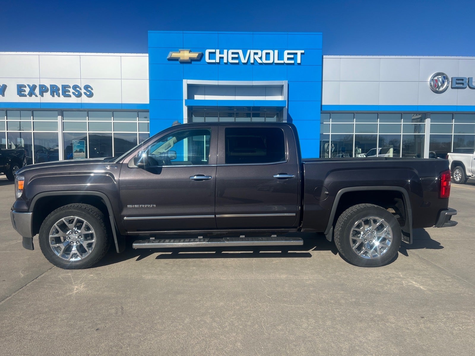 2014 GMC Sierra 1500 SLT in Iridium Metallic — front three-quarter view